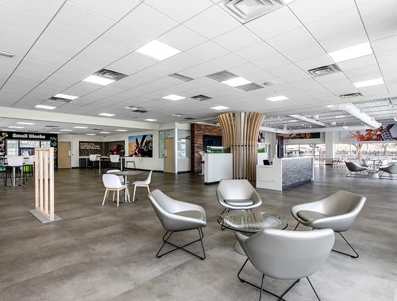 Another view of an EchoPark store, showing a bright interior with modern fixtures and furnishings, and lots of windows.
