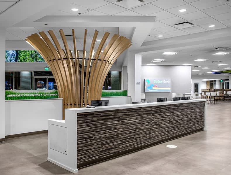 Front desk entrance at EchoPark is welcoming with modern architecture and bright interior.