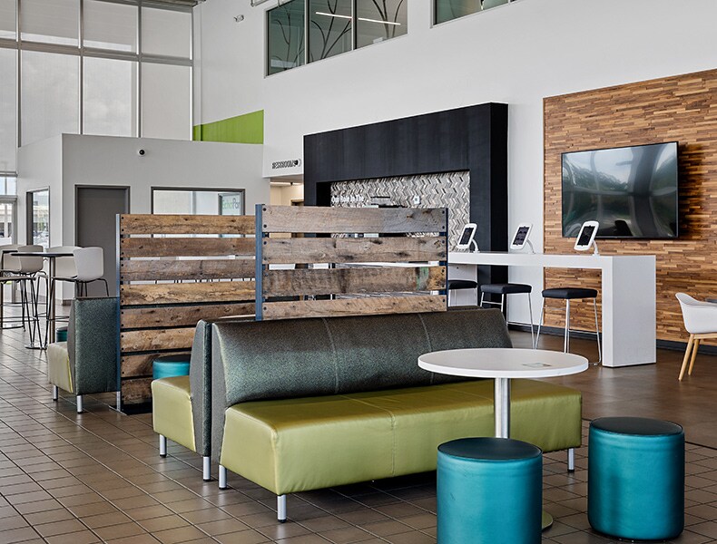 Another view of an EchoPark store, showing a bright interior with modern fixtures and furnishings, and lots of windows.