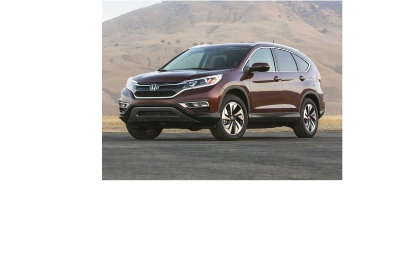 Image shows a parked burgundy Honda CR-V with a large hill in the background.