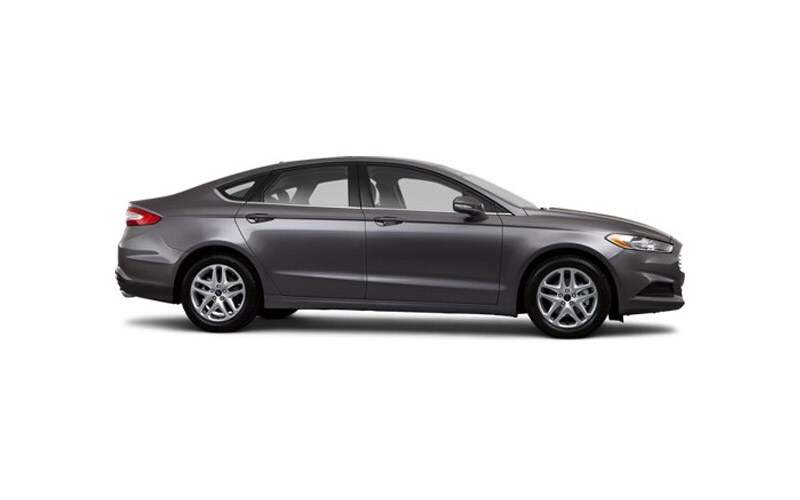 Image shows a dark gray Ford Fusion on a white background.
