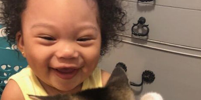 Areala Lopez, 1, can’t hide her excitement over the kitten.