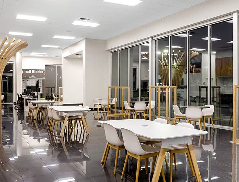 Another view of an EchoPark store, showing a bright interior with modern fixtures and furnishings, and lots of windows.