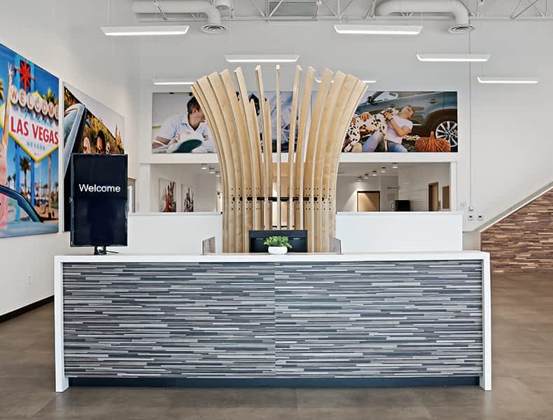 Front desk entrance at EchoPark is welcoming with modern architecture and bright interior.