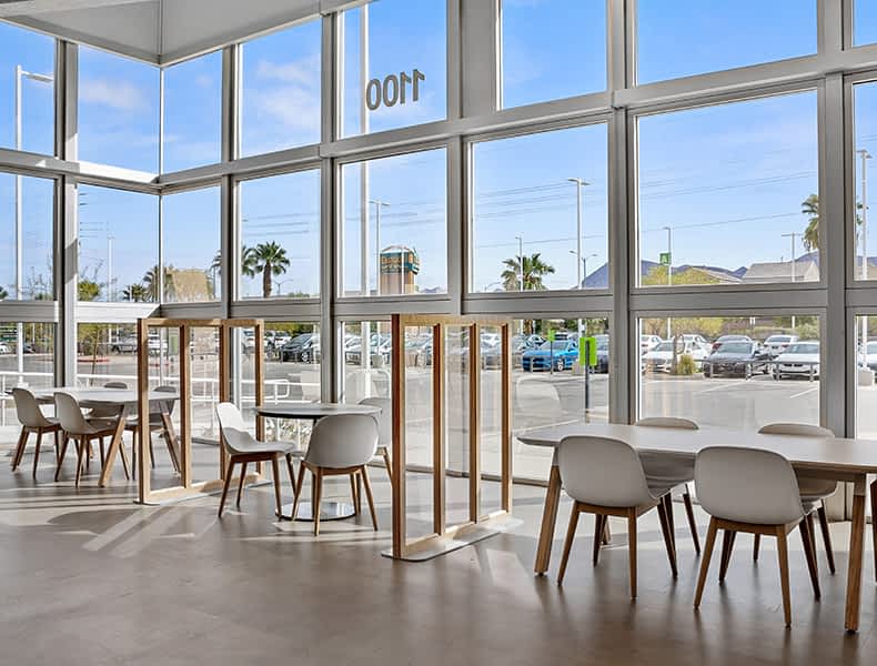Another view of an EchoPark store, showing a bright interior with modern fixtures and furnishings, and lots of windows.