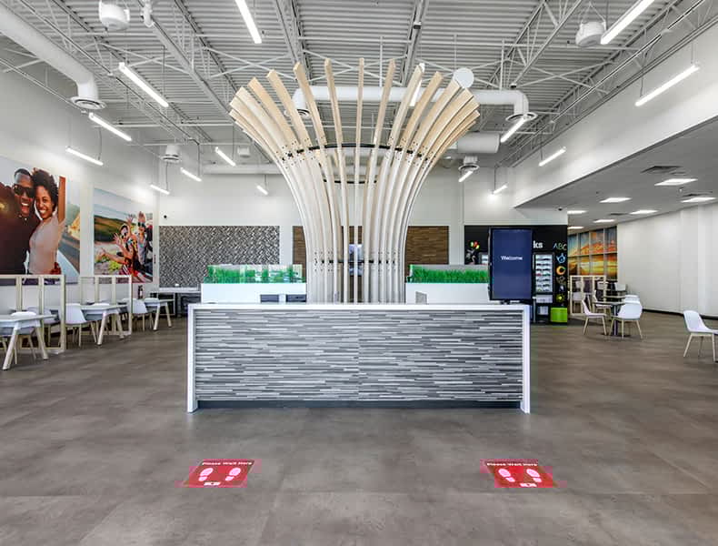 Front desk entrance at EchoPark is welcoming with modern architecture and bright interior.