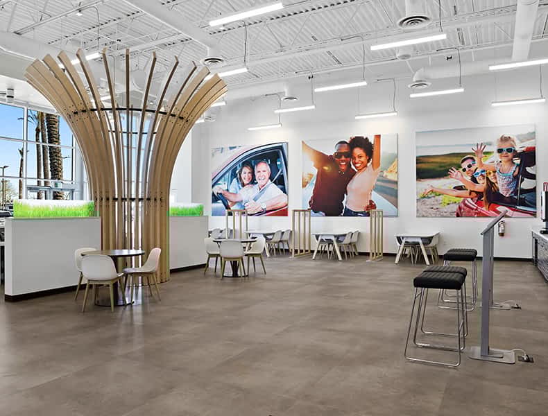 Another view of an EchoPark store, showing a bright interior with modern fixtures and furnishings, and lots of windows.
