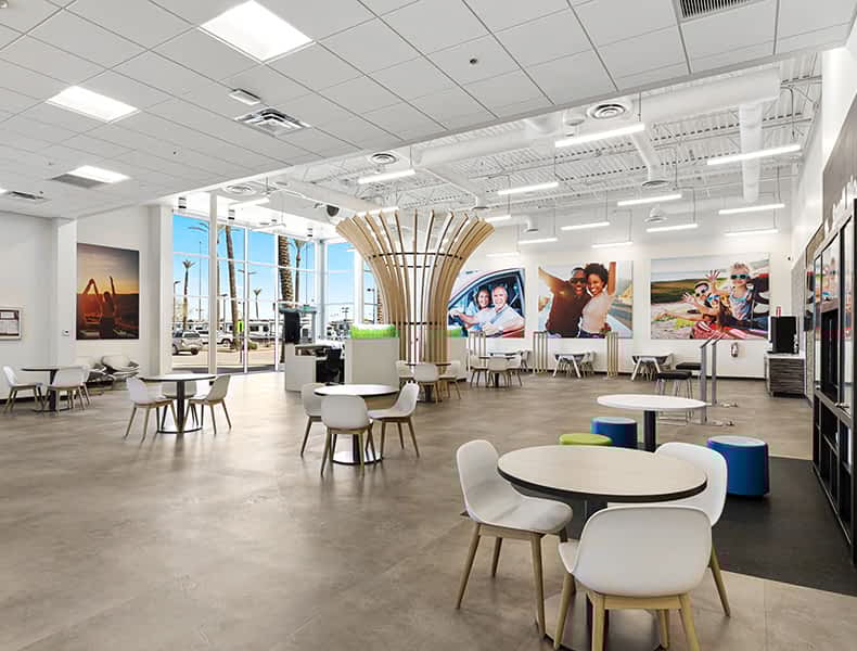 Another view of an EchoPark store, showing a bright interior with modern fixtures and furnishings, and lots of windows.