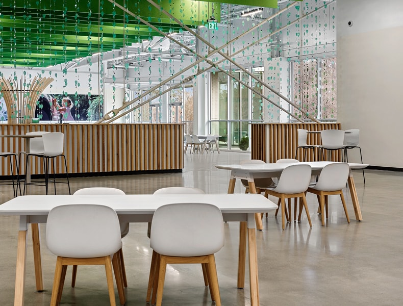 Another view of an EchoPark store, showing a bright interior with modern fixtures and furnishings, and lots of windows.