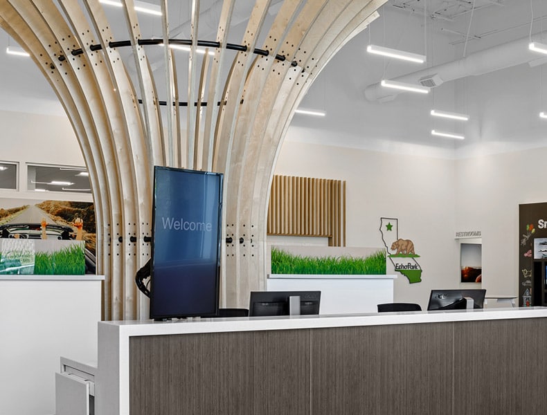Front desk entrance at EchoPark is welcoming with modern architecture and bright interior.