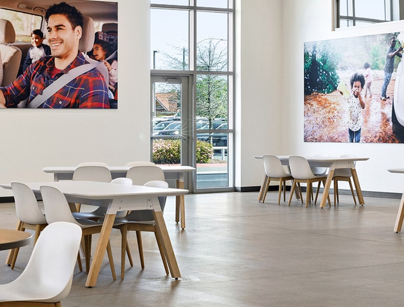Another view of an EchoPark store, showing a bright interior with modern fixtures and furnishings, and lots of windows.