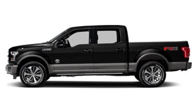 Image shows a black Ford F-150 parked in a desert area.