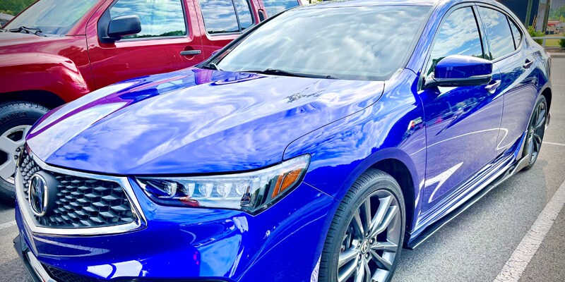 Photo shows an electric blue Acura TLX A-Spec