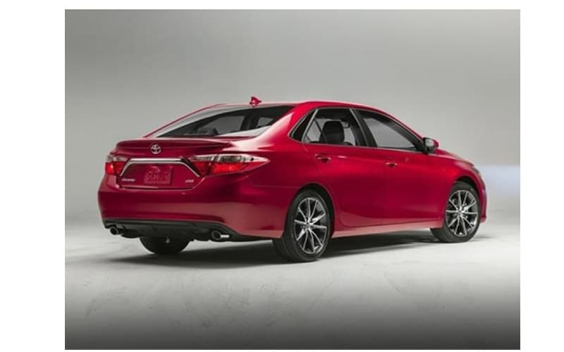 Image shows a red Toyota Camry on a gray background.