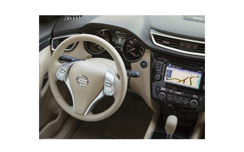 Image shows the dashboard of a Nissan, model unknown.