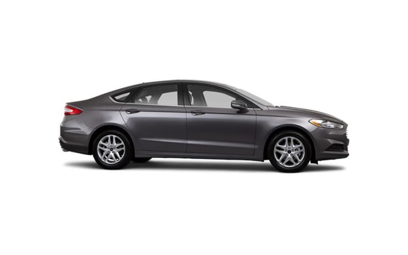 Image shows a dark gray Ford Fusion on a white background.